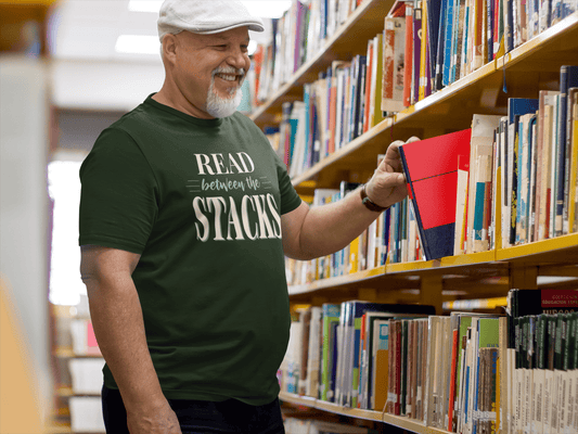 Read Between The Stacks — Vintage Book Lover Tee